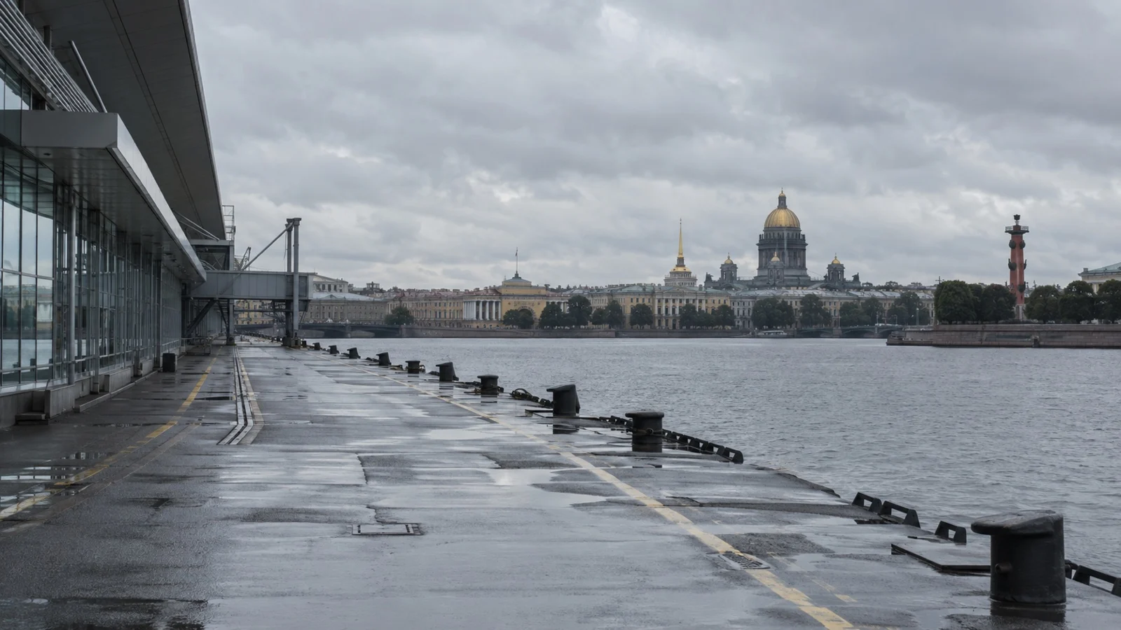 Empty cruise berth at St Petersburg waterfront under gray sky