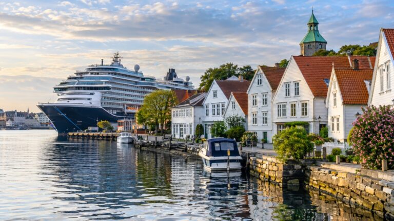 A cruise ship beside Stavanger's white wooden old town houses