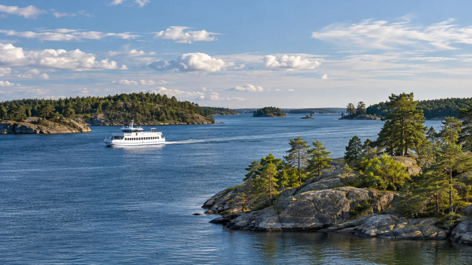 Passenger ferry sailing among pine-covered islands in the Stockholm archipelago