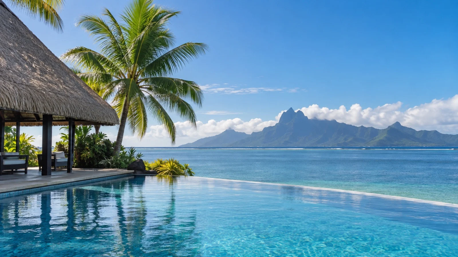 Empty resort pool overlooking the Tahiti lagoon and distant Moorea