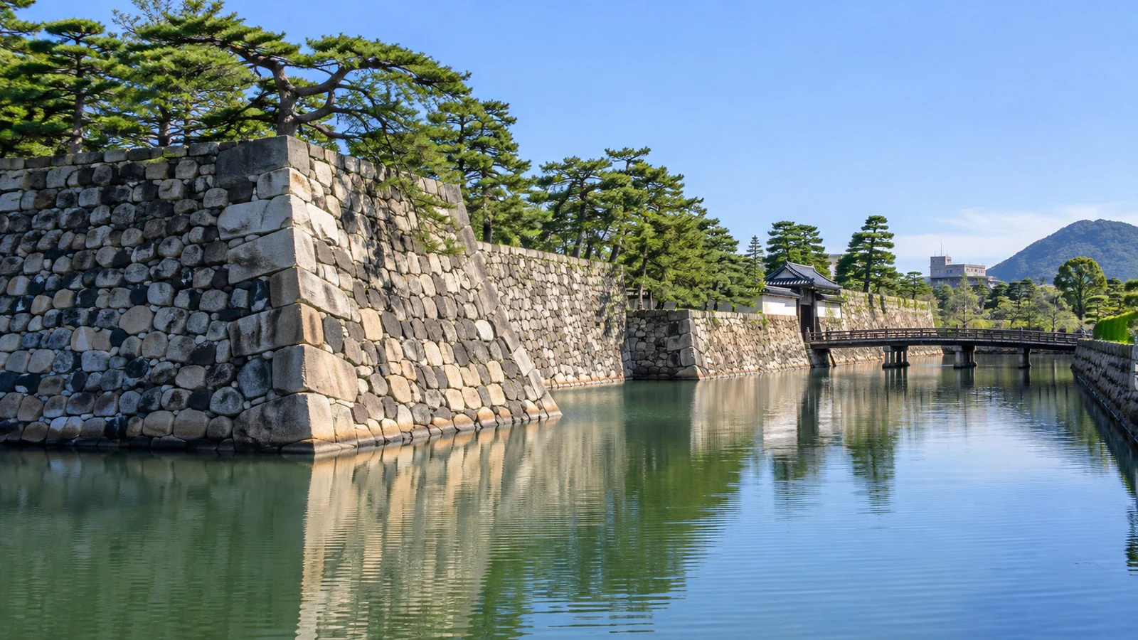 Stone walls and moat of Takamatsu Castle in Tamamo Park