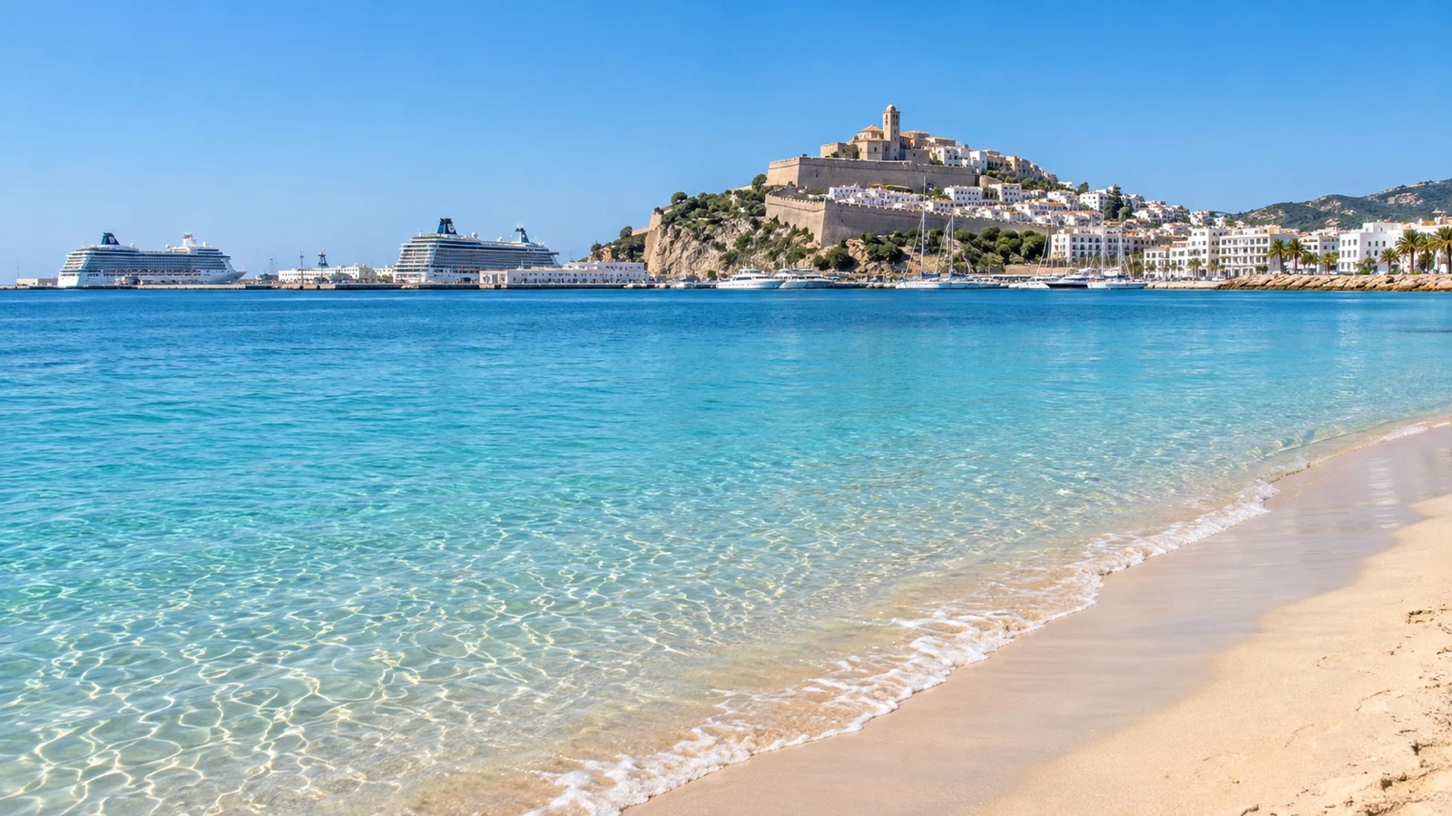 Pale sand and clear water at Talamanca Beach near Ibiza Town