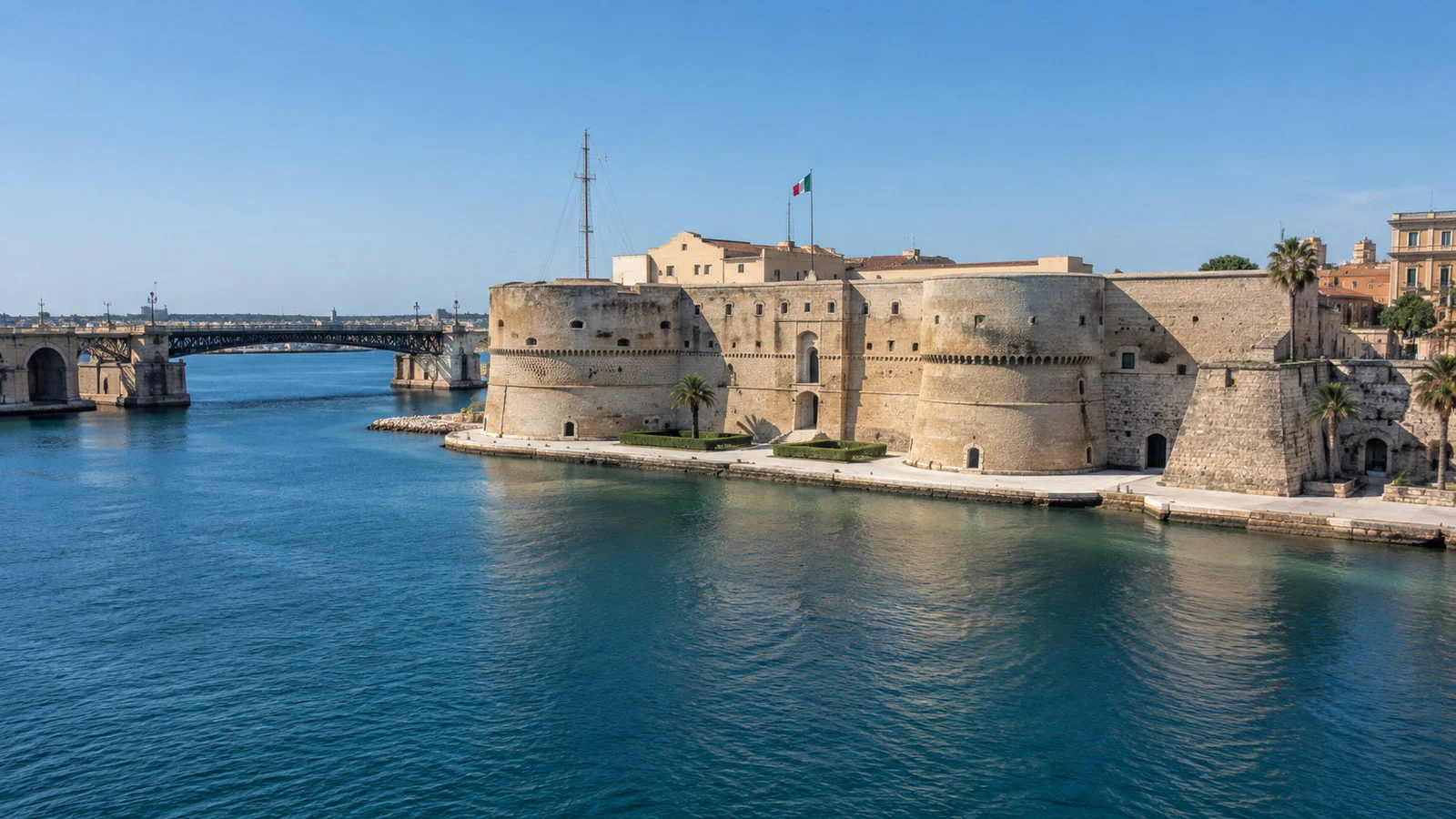 Aragonese Castle Taranto Italy stone coastal fortress beside swing bridge and blue water, no people