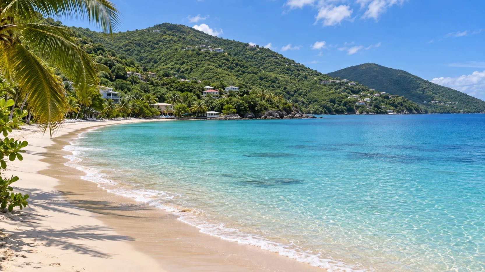 Crescent beach and calm water at Tortola’s Cane Garden Bay