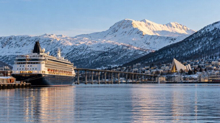 A cruise ship in Tromsø harbor with the Arctic Cathedral across the water