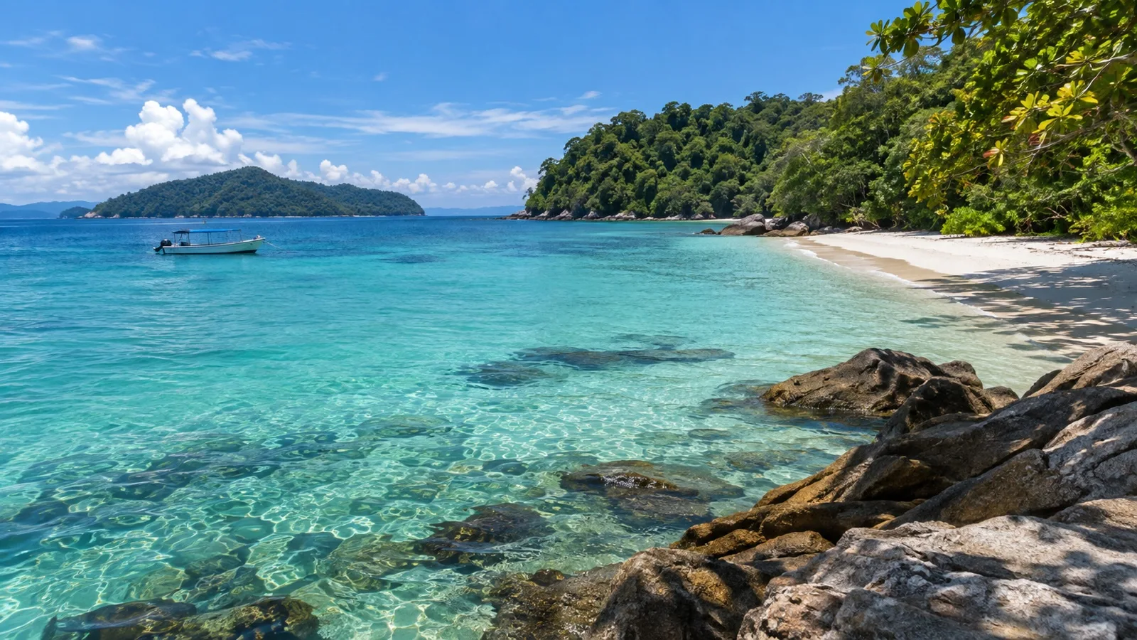 Clear water and green islands in Tunku Abdul Rahman Marine Park