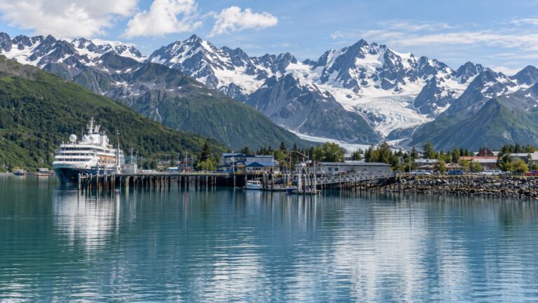Cruise ship at the Valdez Alaska waterfront beneath Chugach Mountains