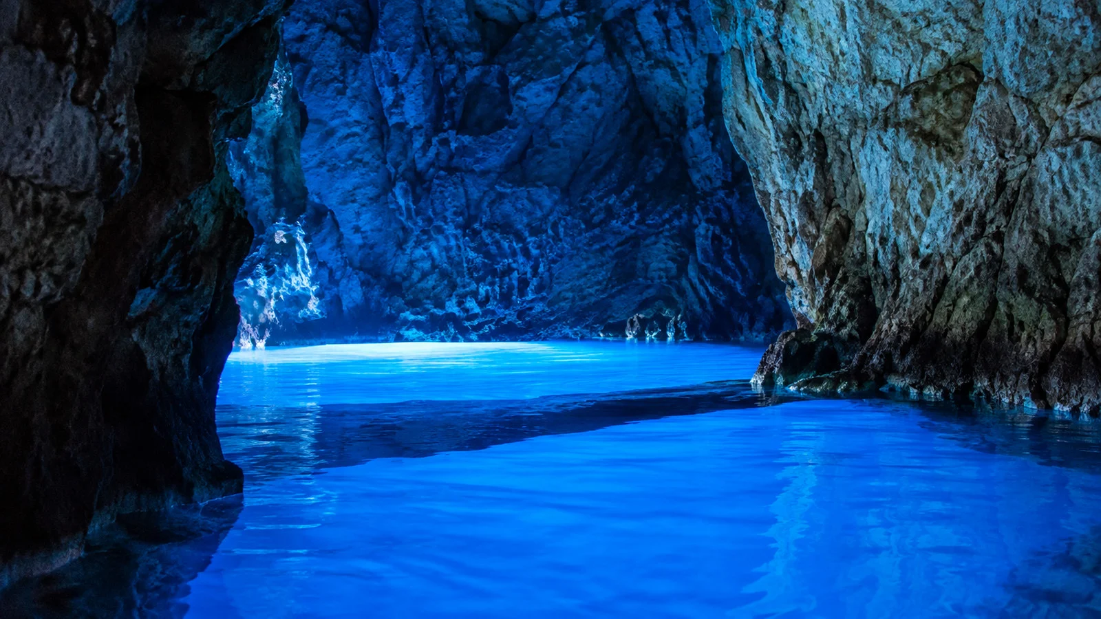 Blue Cave Modra Spilja on Bisevo island Croatia glowing blue water inside sea cave, no people or boats