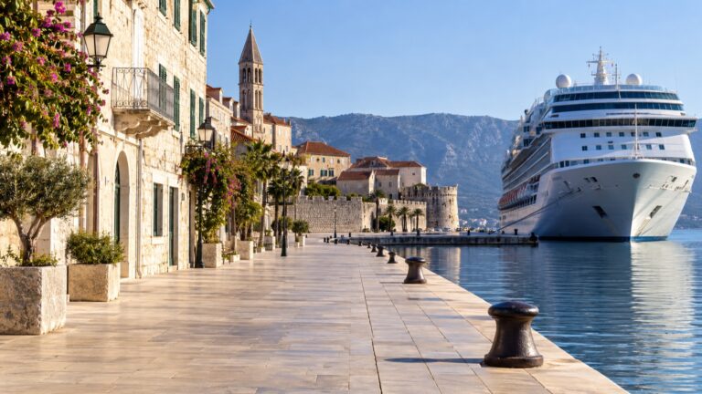 Historic old town and empty promenade directly beside a cruise pier
