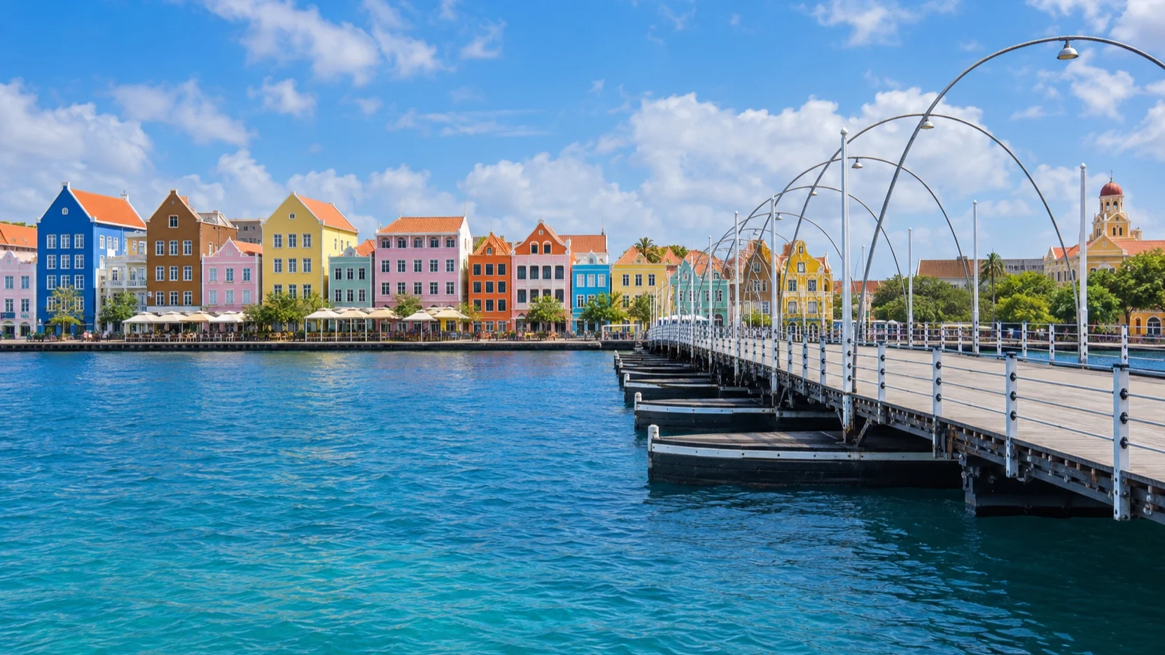 Queen Emma Bridge facing Willemstad's colorful Handelskade waterfront