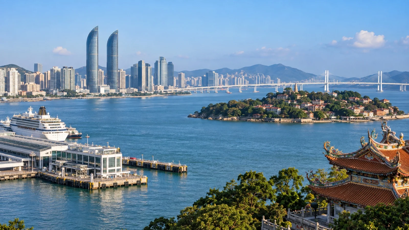 Xiamen city skyline and bridges across the harbor