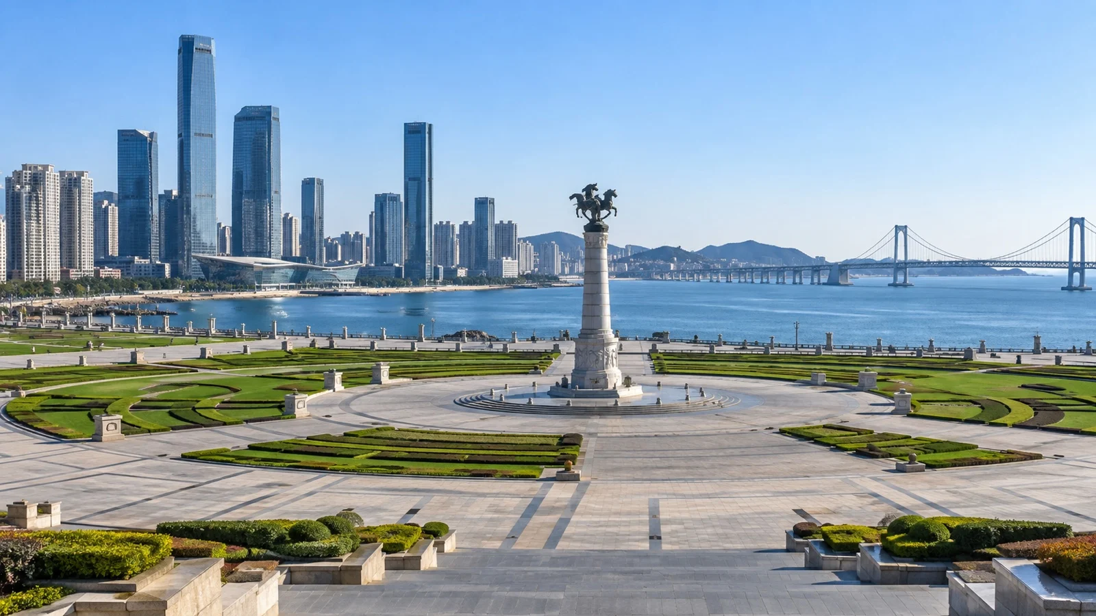Broad Xinghai Square beside Dalian coast and skyline