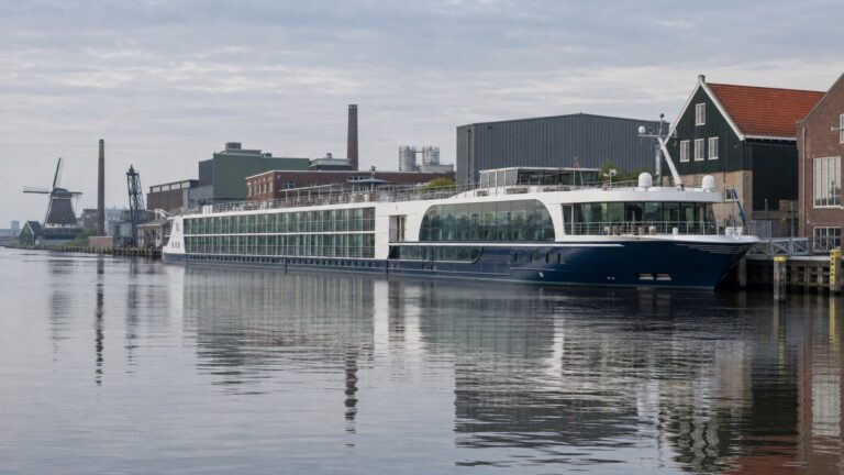 River cruise ship moored along the Zaan beside Zaandam’s industrial waterfront