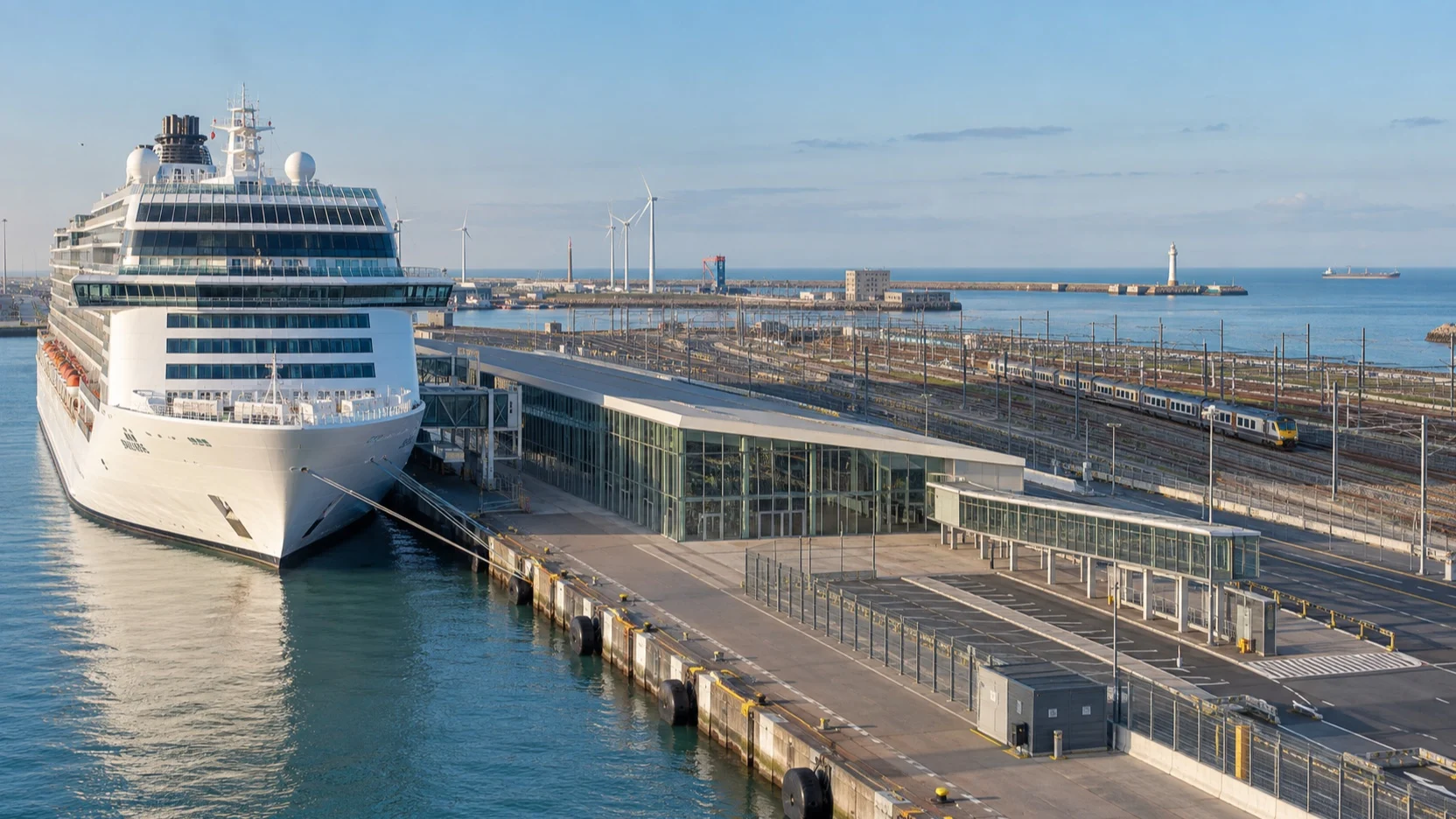 Cruise ship docked at Zeebrugge port beside rail infrastructure